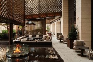 garden terrace with screens and firepit at Aman New York