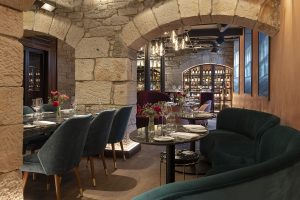 stonework and velvet in eclectic mix in commons club restaurant in virgin hotel edinburgh