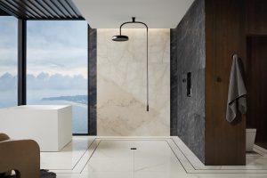 Kohler shower head matte black against wall and floor in marble and stone layered textures