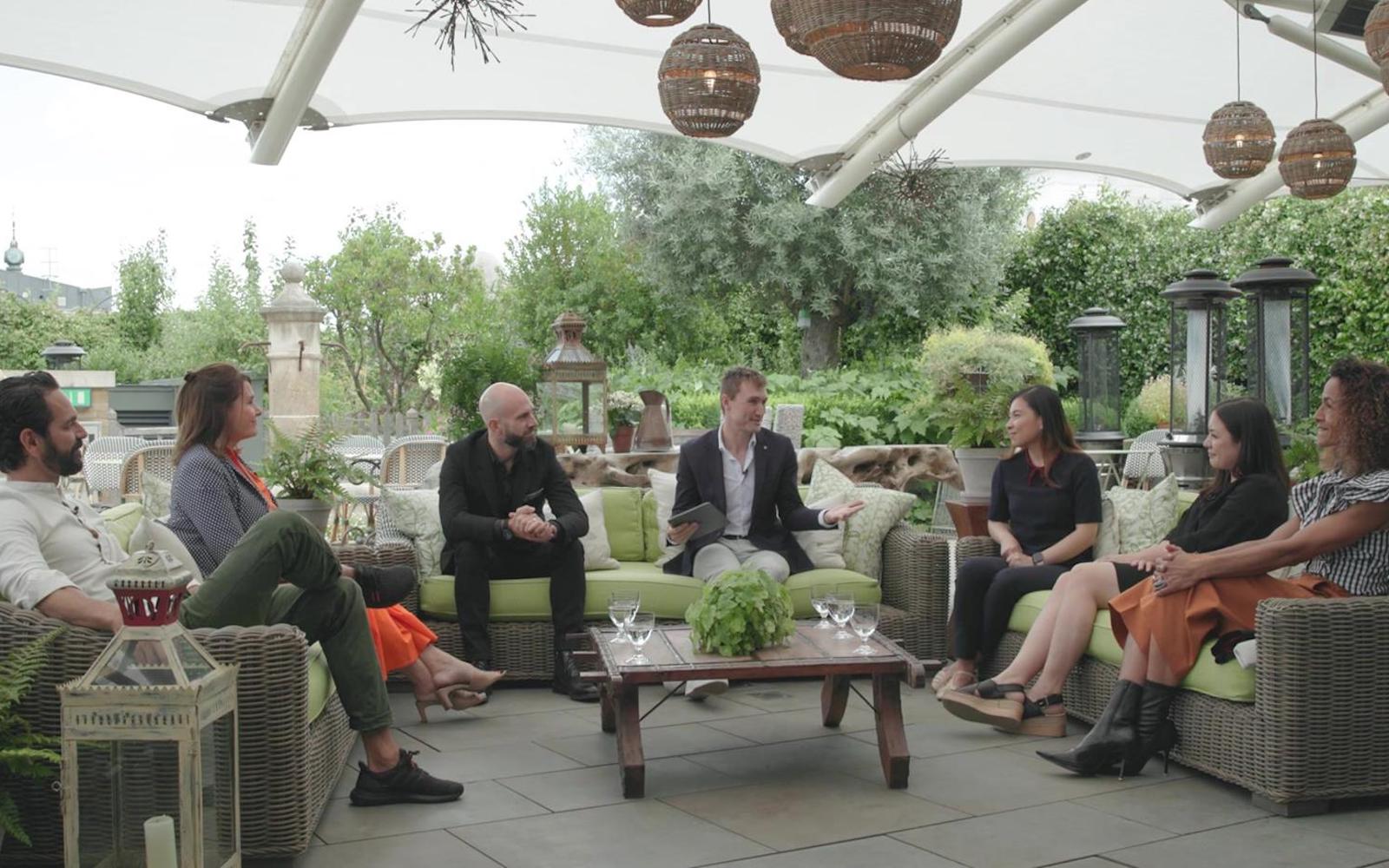 Designs sitting on sofas on rooftop of Ham Yard Hotel for roundtable discussion