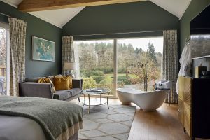 The Lookout guestroom at Tawney Hill with views over the hills from the bed and the bath