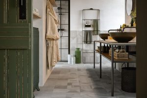 grey porcelain tiles with pattern on bathroom floor and wall with green accents