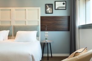 guestrooms designed by THDP using white and grey and wood