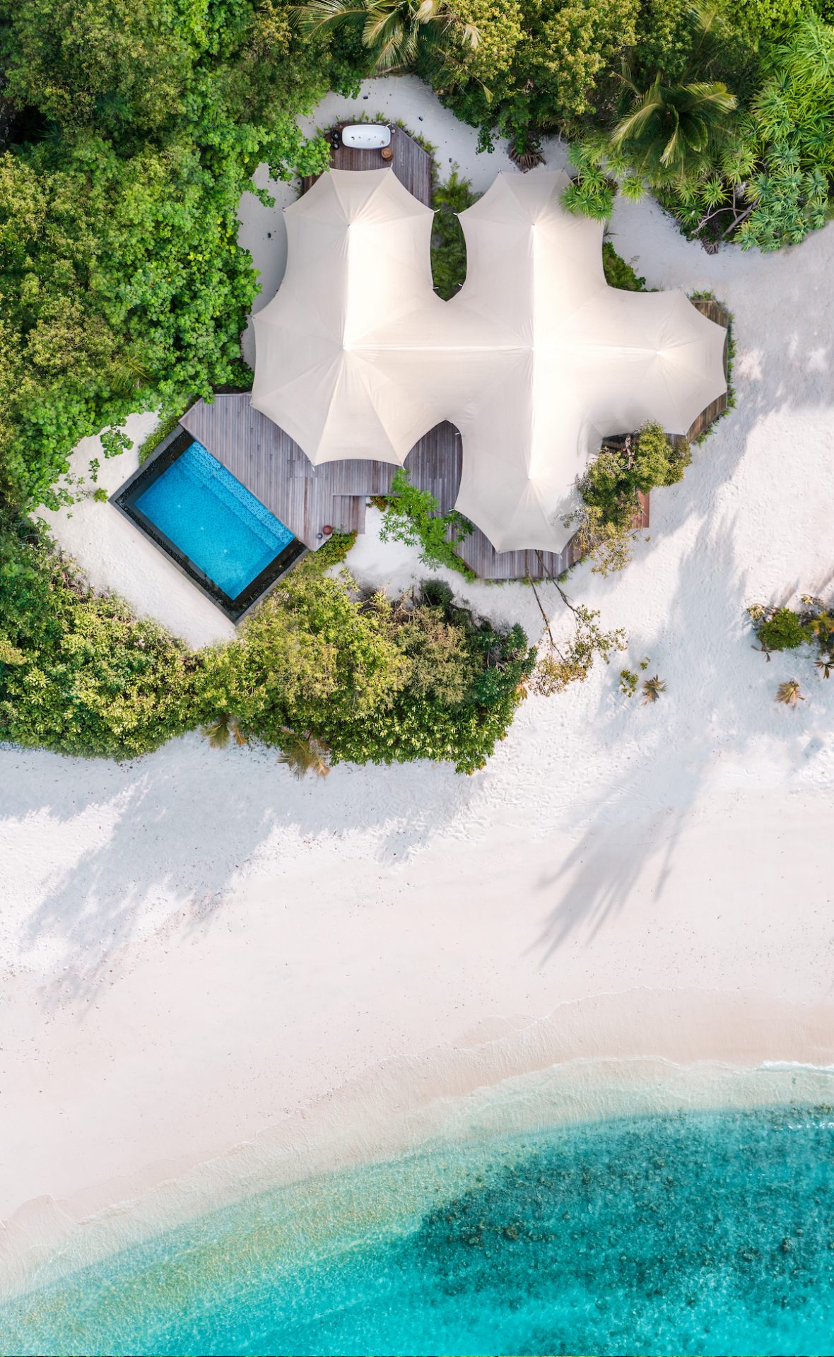 Aerial view of tented beach villa in the Maldives