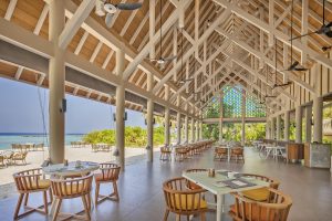 open air restaurant at Faarufushi built under beamed ceiling on the beach