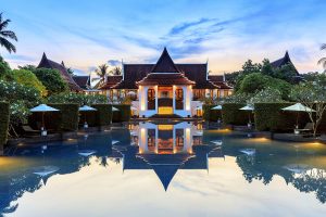 façade and reflections in the water around the JW Marriott Khao Lak Resort Suites