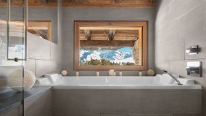the bathroom at The Idéal suite from Four Seasons Megève Collection with perfectly framed mountain view