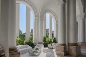exterior lounge with sweeping white arches and pillars at the NH Collection Milano CityLife