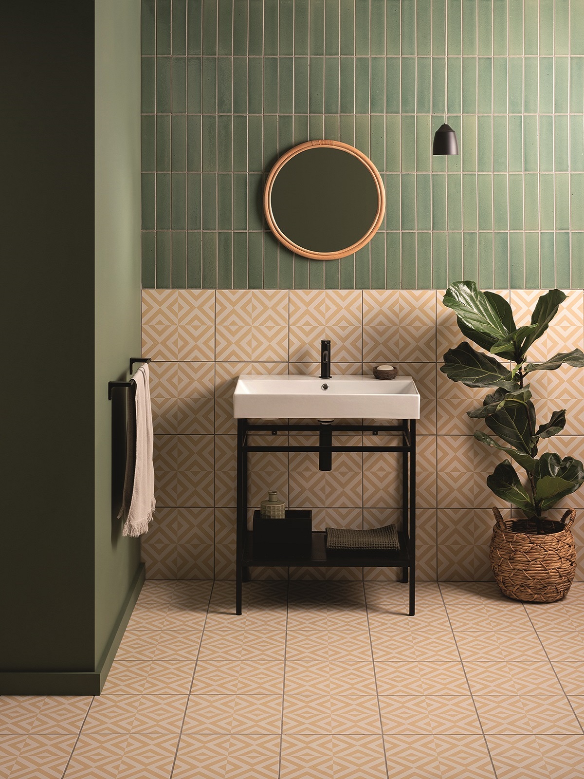 olive green and pink contrat tiles in bathroom with wood and plant