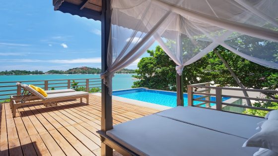 deck, pool and sunlounger overlooking the sea at The Tongsai Bay