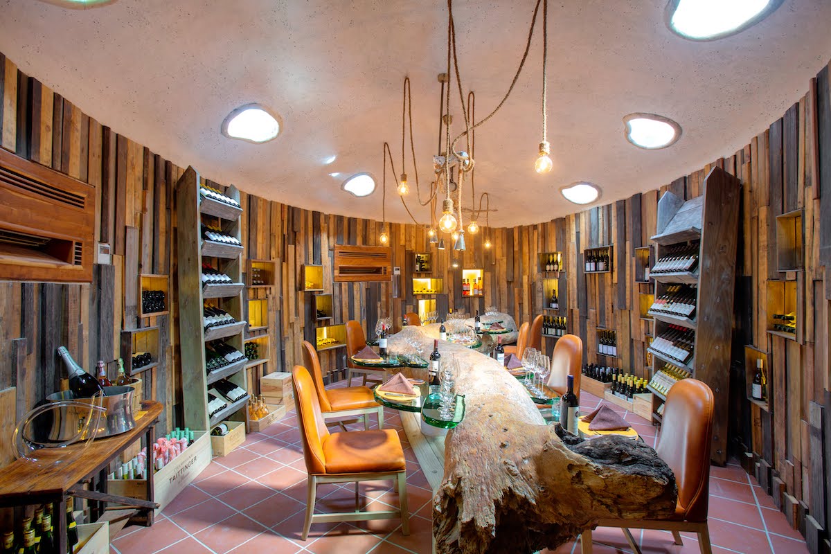 Underground wine cellar with tree trunk as a table