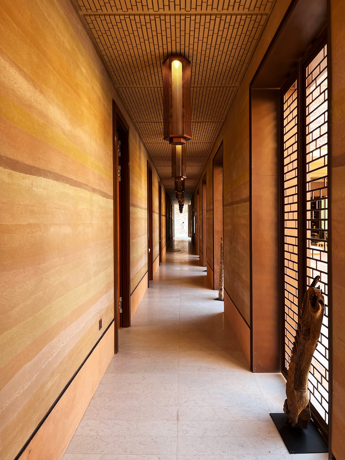 sand coloured interior in passageway at Banyan Tree Alula