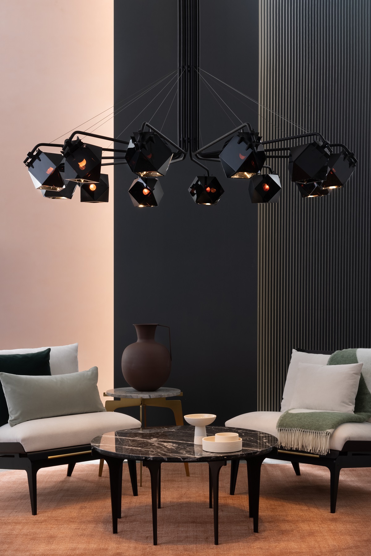 chandelier in black over table and chairs designed by Alessandro Munge for Gabriel Scott