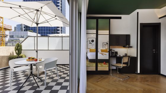 Theodor Brown Hotel in Tel Aviv with guestroom leading onto art deco tiled terrace