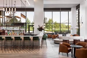 seating at the bar and at tables in Nashville Four Seasons with floor to ceiling windows giving views of outdoors