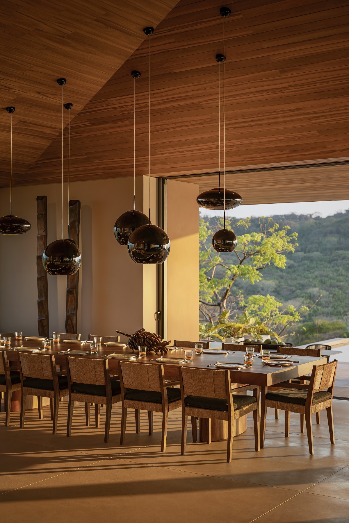pitched wooden ceilings above the dining table in luxury villa in One&Only Mandarina