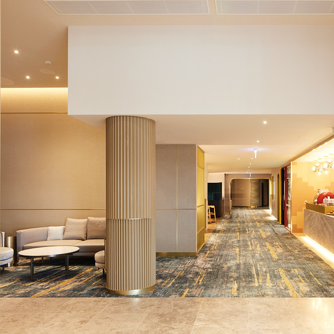 lobby in Petersham RSL in Australia in cream and gold detail with blue Modieus carpet in corridor