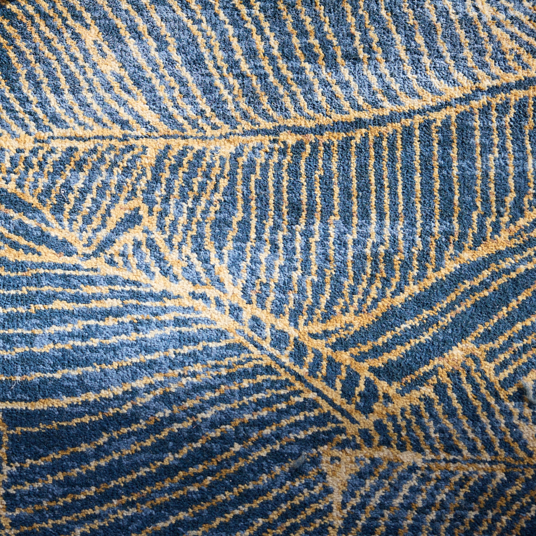 detail of blue and gold organic carpet design by Modieus for Petersham