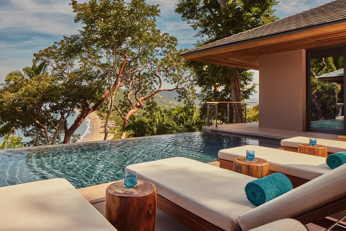 plunge pool at Mandarina with sun loungers towels and drinks