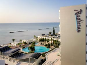 exterior view of resort, beach and swimming pool at Radisson Beach Resort Larnaca
