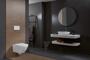 white universal twistflush toilet by Villeroy & boch in a dark grey bathroom with round mirror