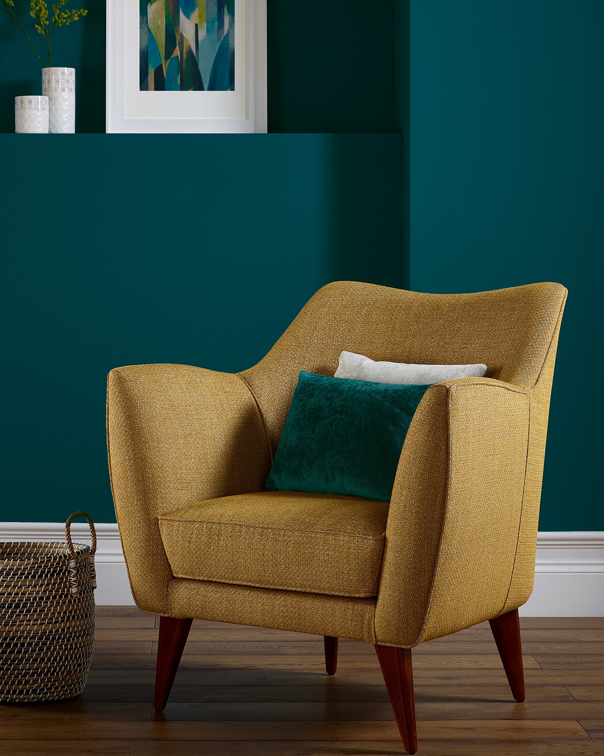 upholstered chair in Odisha by Sekers against teal blue wall
