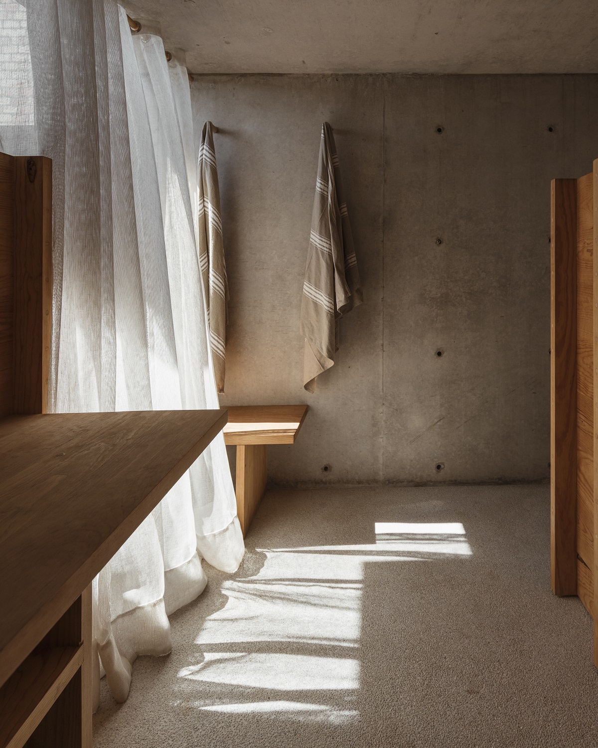 concrete wood and natural fibres in the guestrooms at Terrestre Mexico