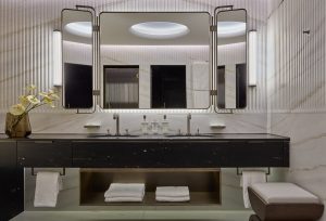 black and white bathroom with double basin and marble surfaces in Mandarin Oriental Luzern