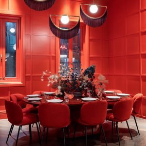 red walls and chairs in Lola rouge in Naumi Wellington