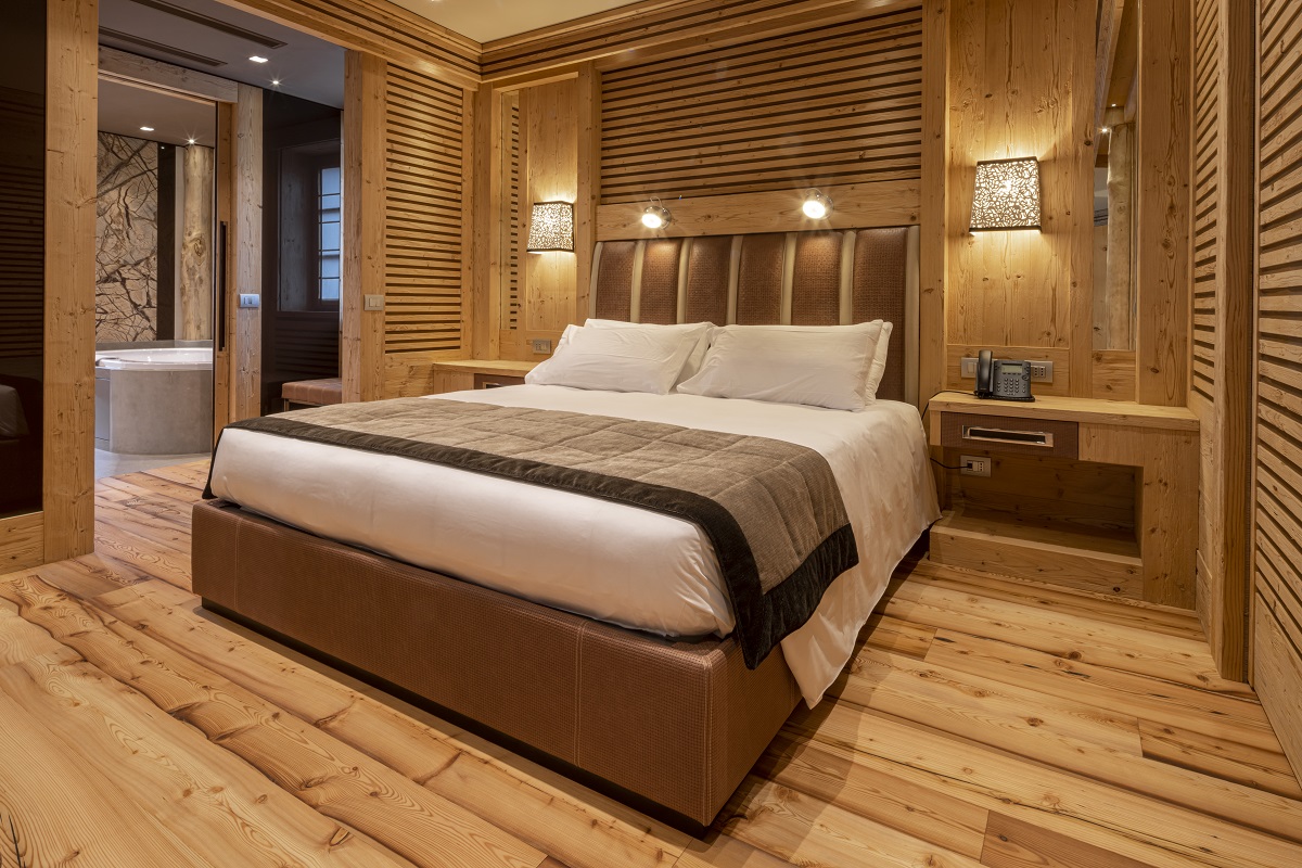Rosapetra Spa Resort guestroom clad in warm alpine wood