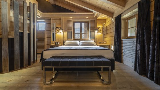 bedroom with warm wooden surfaces at Rosapetra Spa Resort