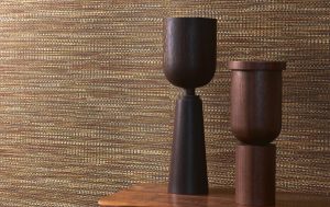 detail of textured Geloma wallcovering from Arte with wooden objet in the foreground