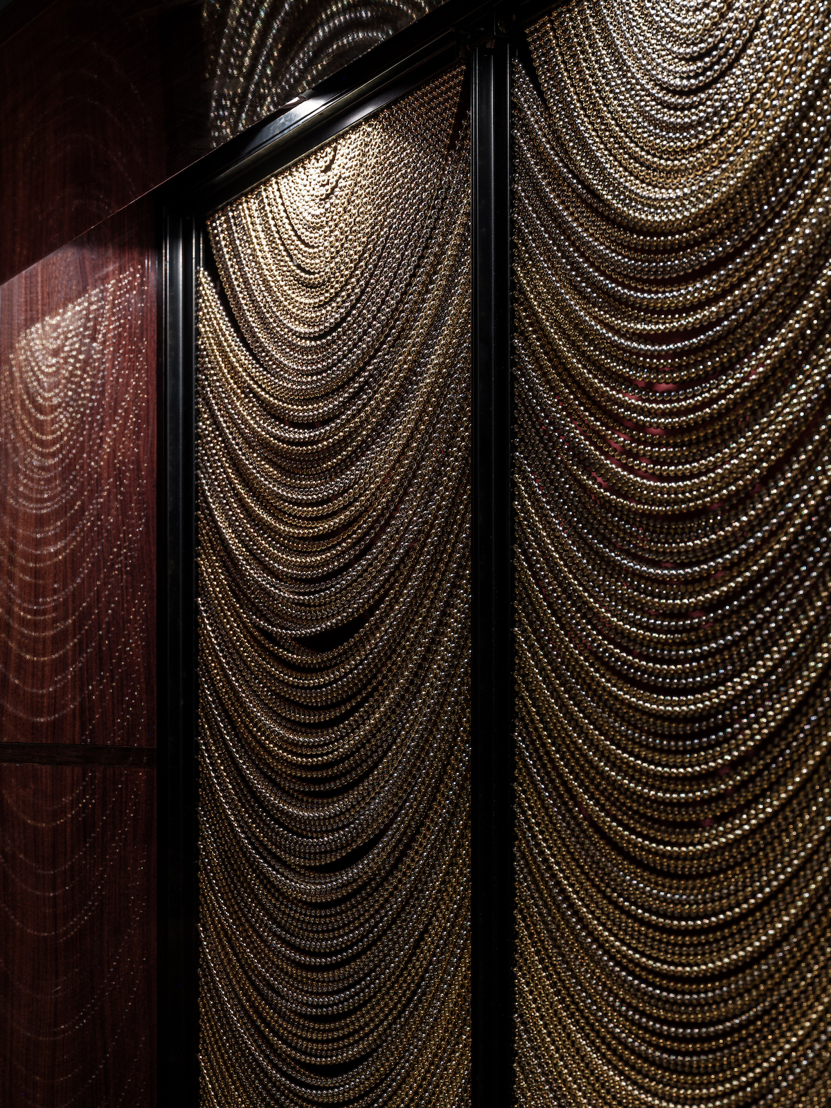 Close up of metal drapes in cocktail bar