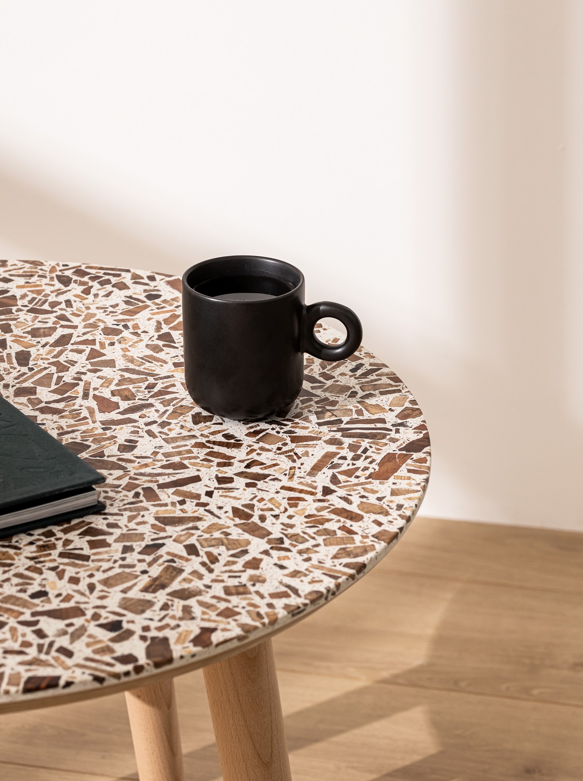 coffee cup on a table with a foresso wood terrazzo surface design