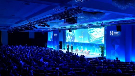 blue lighting on stage at the International Hospitality Investment Forum