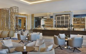 the lobby and lounge space in cream and wood surfaces at the Marriott Resort Palm Jumeirah, Dubai