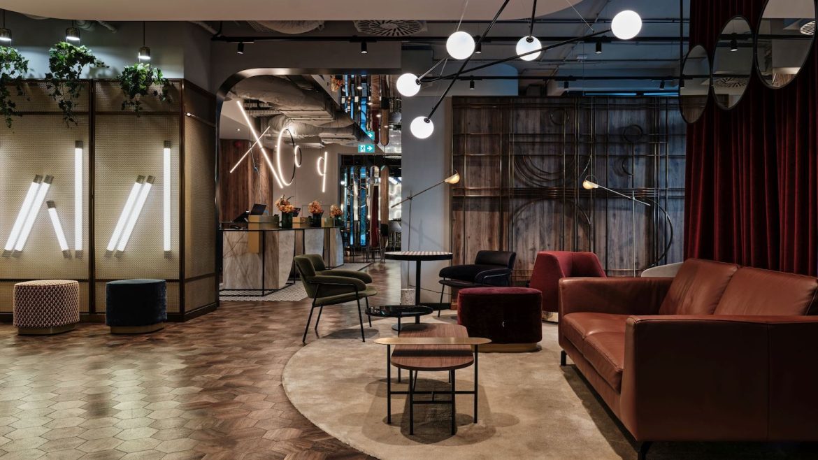 Modern, industrial public areas in aparthotel in Warsaw