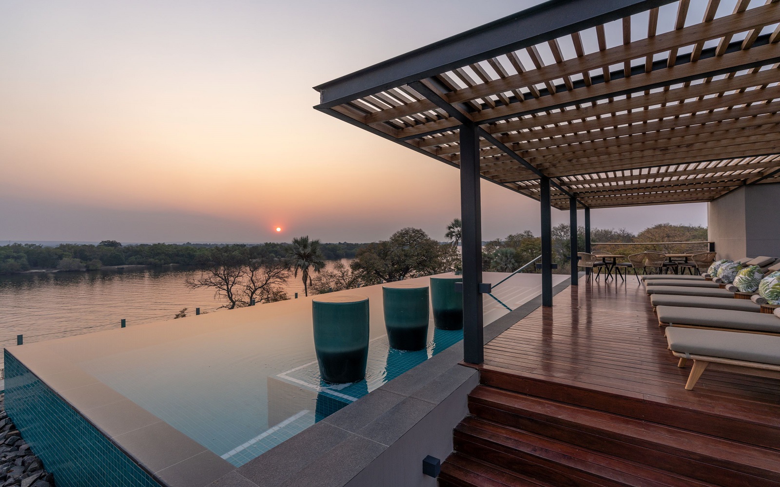 sunset view over swimming pool at Radisson Blu Mosi-oa-Tunya, Livingstone Resort