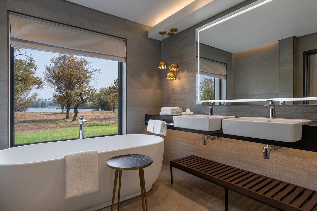 freestanding bath and window with view at Radisson Blu Mosi-oa-Tunya, Livingstone Resort