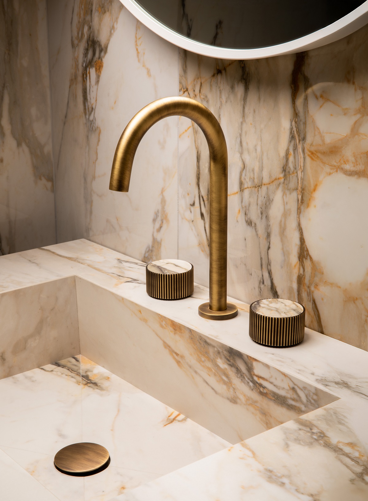 marble handbasin and gold tap in chiasso range