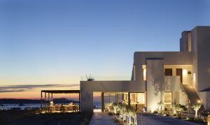 minimalist white architecture at sunset at Domes White Coast Milos