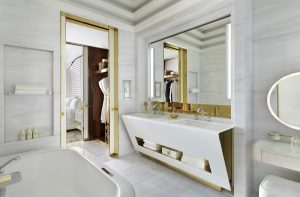 white and gold surfaces in the bathroom at Fairmont Doha