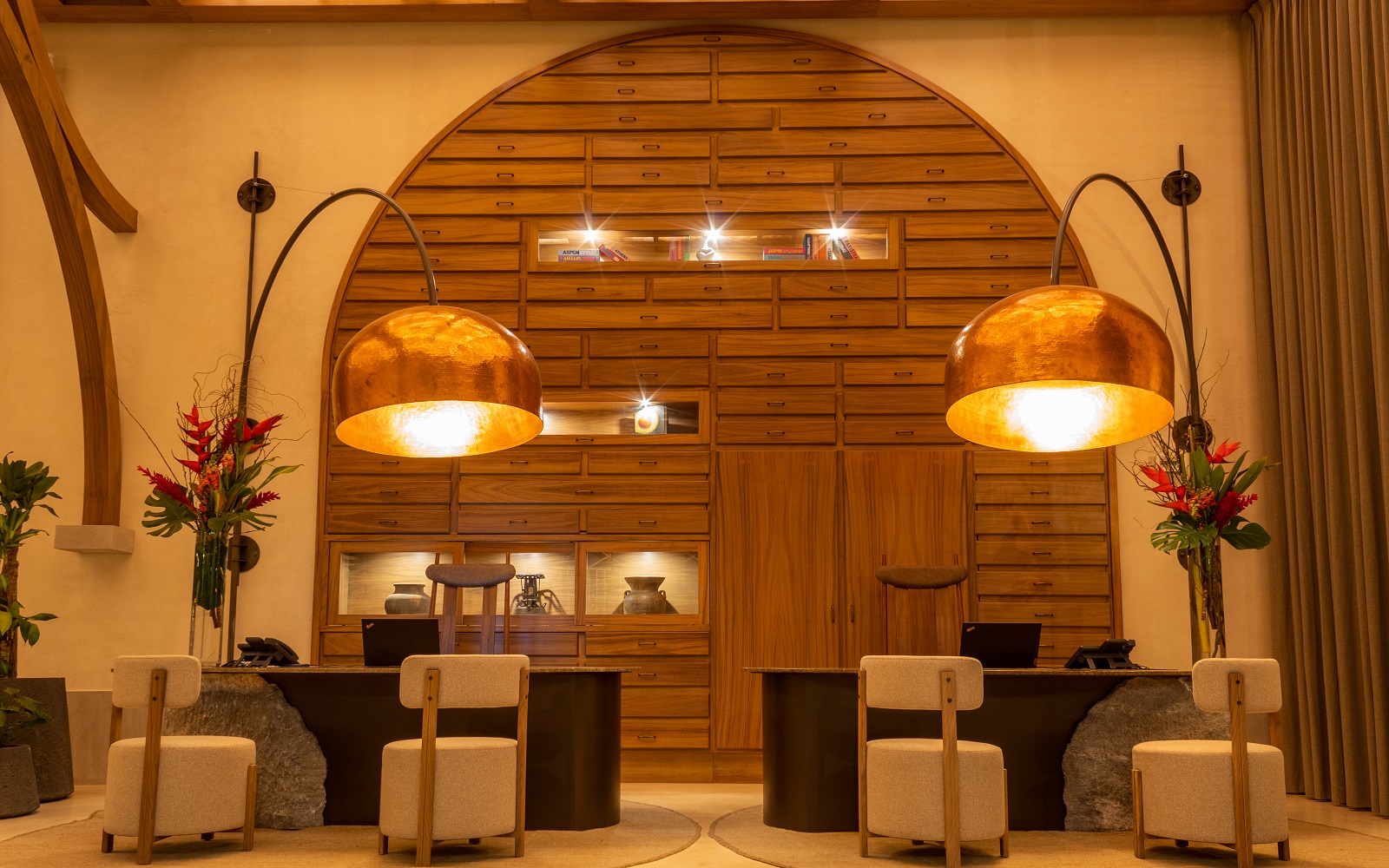 Front desk at NUMU with wood panelling and statement bell lighting Hyatt Unbound Collection