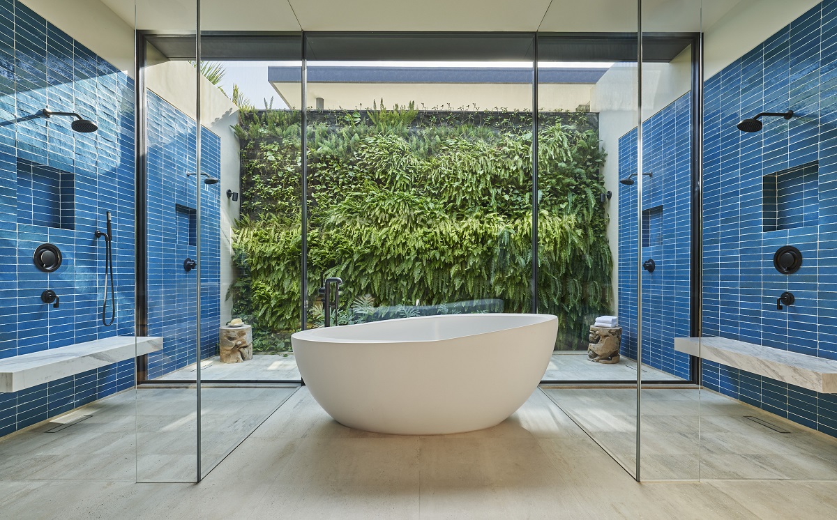 free standing bath in luxury blue tiled bathroom at Four Seasons Los Cabos