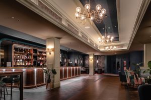 wooden surfaces, bespoke lighting and patterend fabrics in the Late Lounge Bar at Heythrop Park Hotel