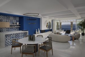 blue and white tiles, blue walls, white curved furniture in the villa at Mykonos Grand