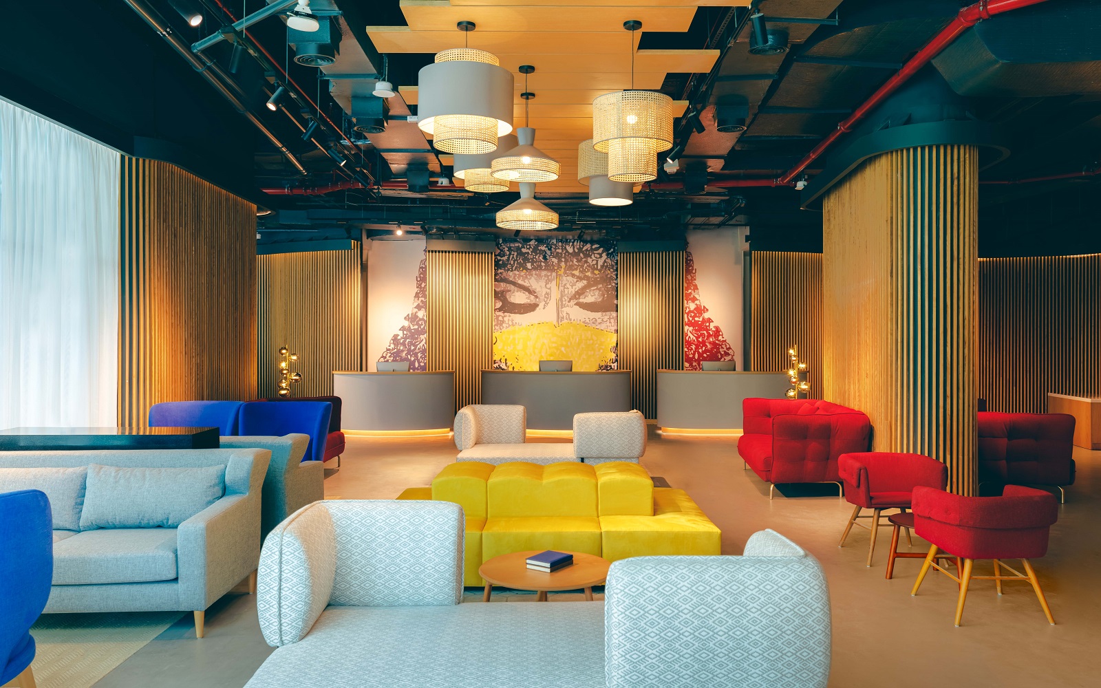 NH Collection dubai The Palm lobby with seating in primary colours