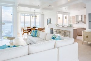 white furniture with blue accents in the Ocean Point Residence at Windjammer Landing Villa Beach Resort