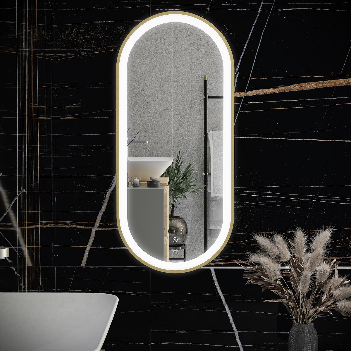 RAK Oval bathroom mirror on black marble wall