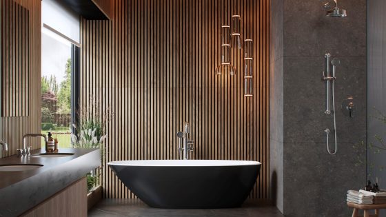 black freestanding bath from Perrin & Rowe Armstrong bathroom collection in front of wood clad walls and concrete surfaces